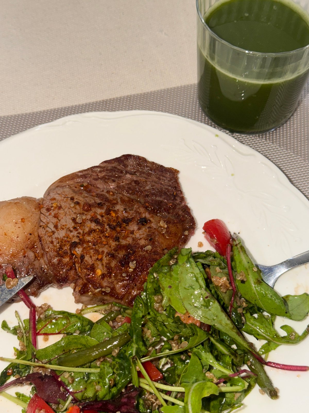 Steak and quinoa salad plate, shot from above in Tel Aviv