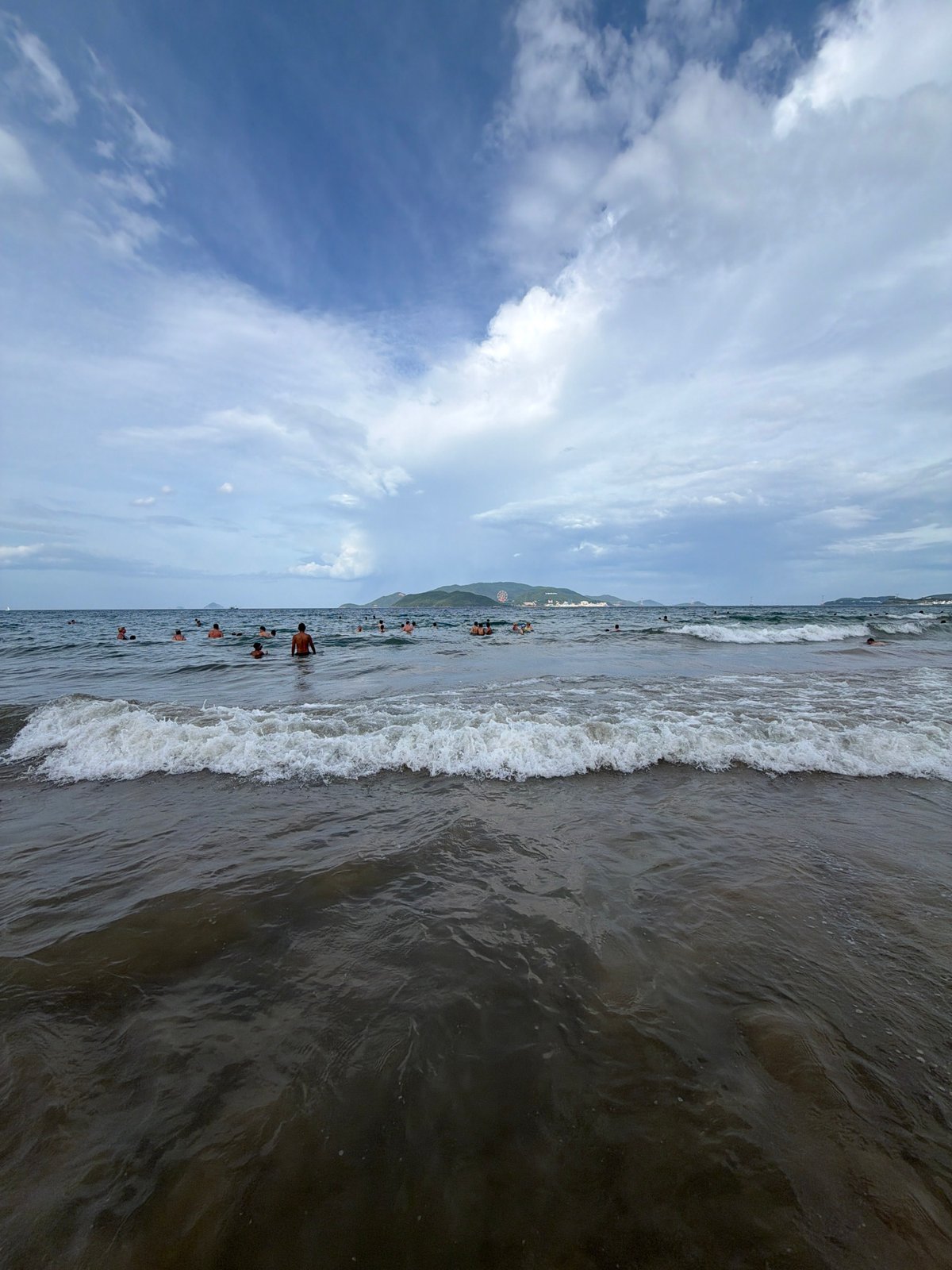 Busy morning at Nha Trang beach with Vinpearl in the backdrop