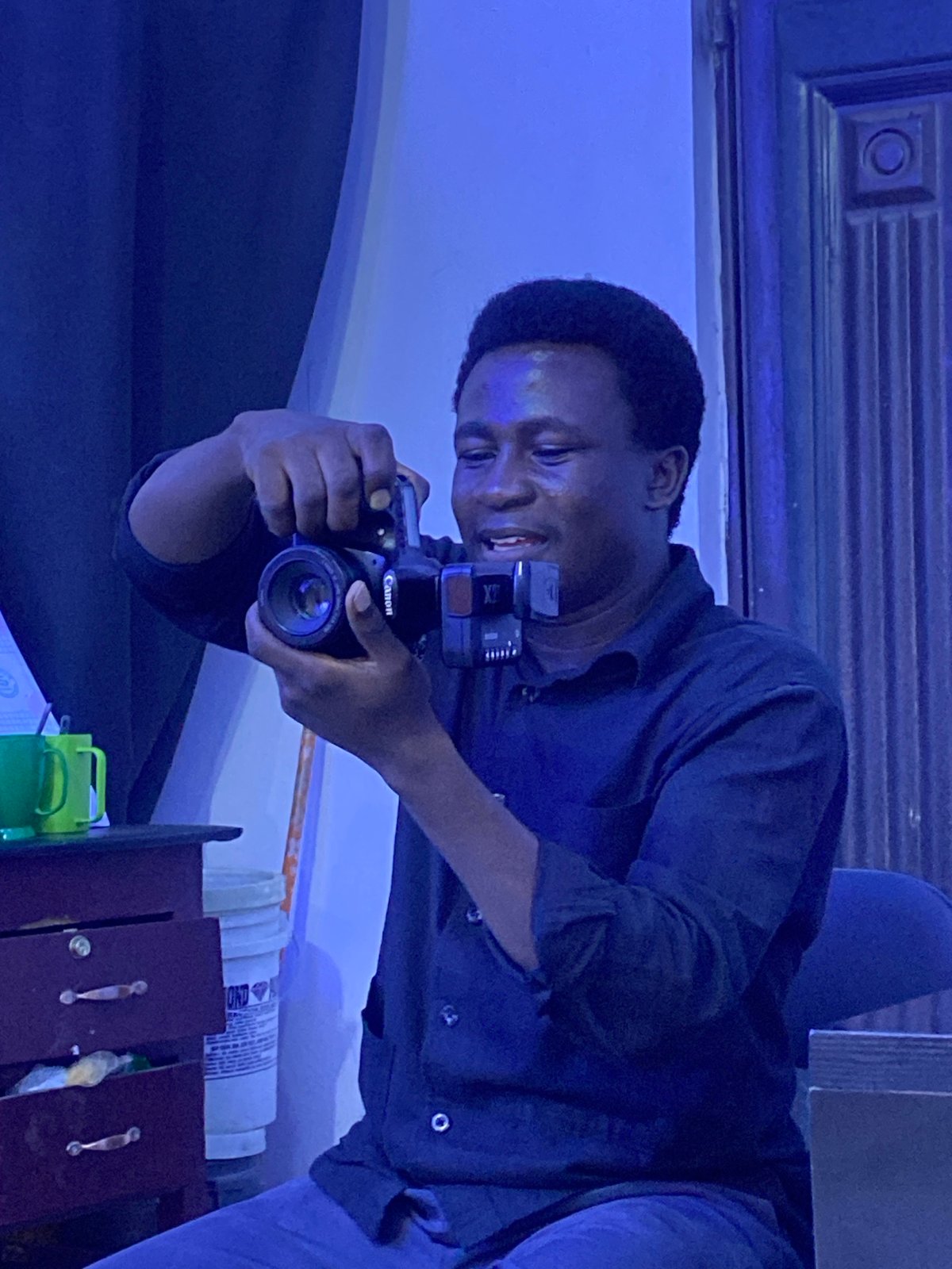 Portrait session underway at a small studio in Gura Top, Nigeria