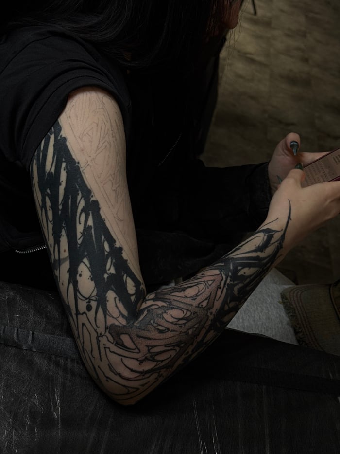 Moscow indoor scenes: tattoo work, furniture, camera gear documented