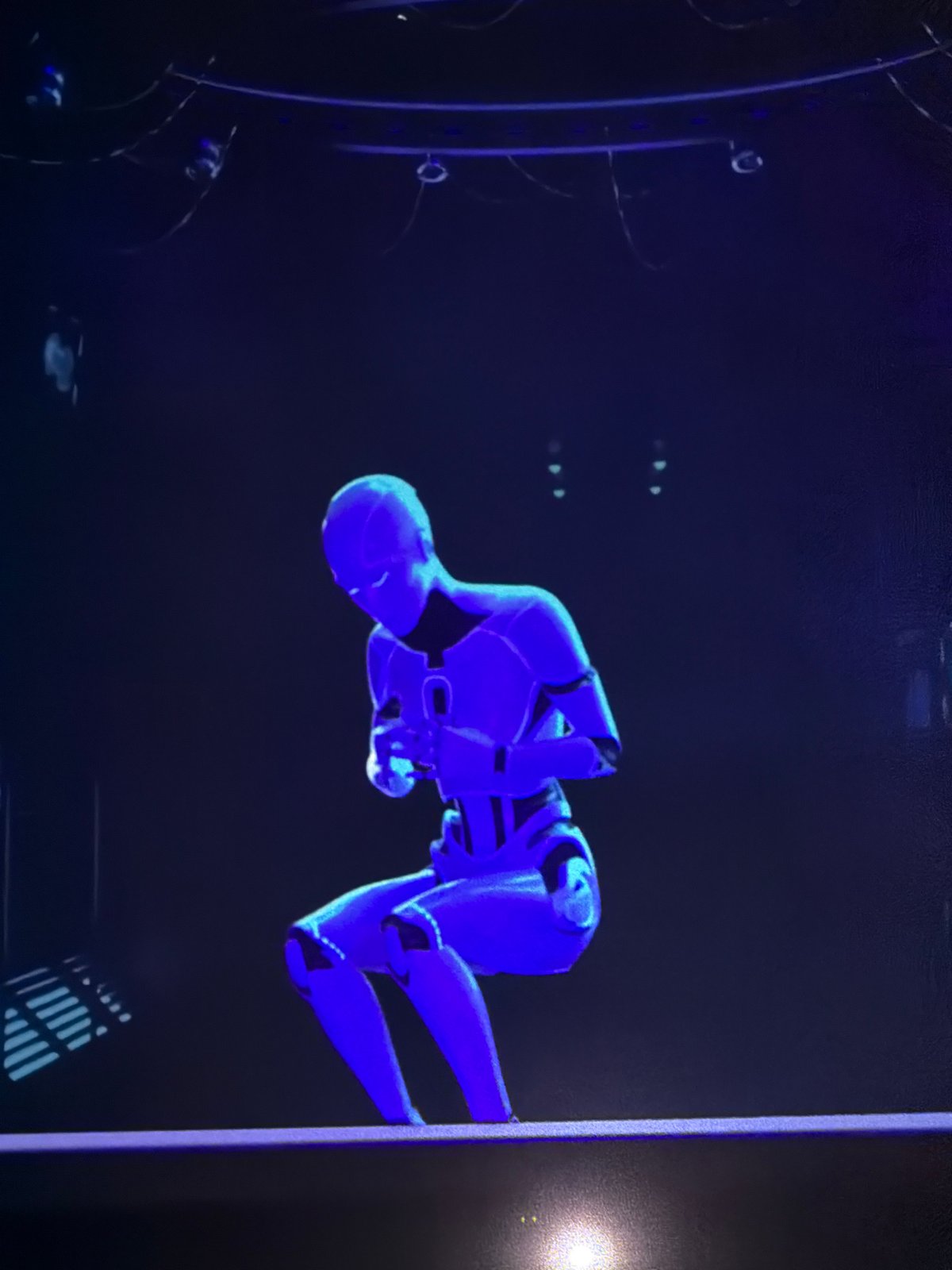 Immersive art exhibition blending holographic robots and glowing light installations