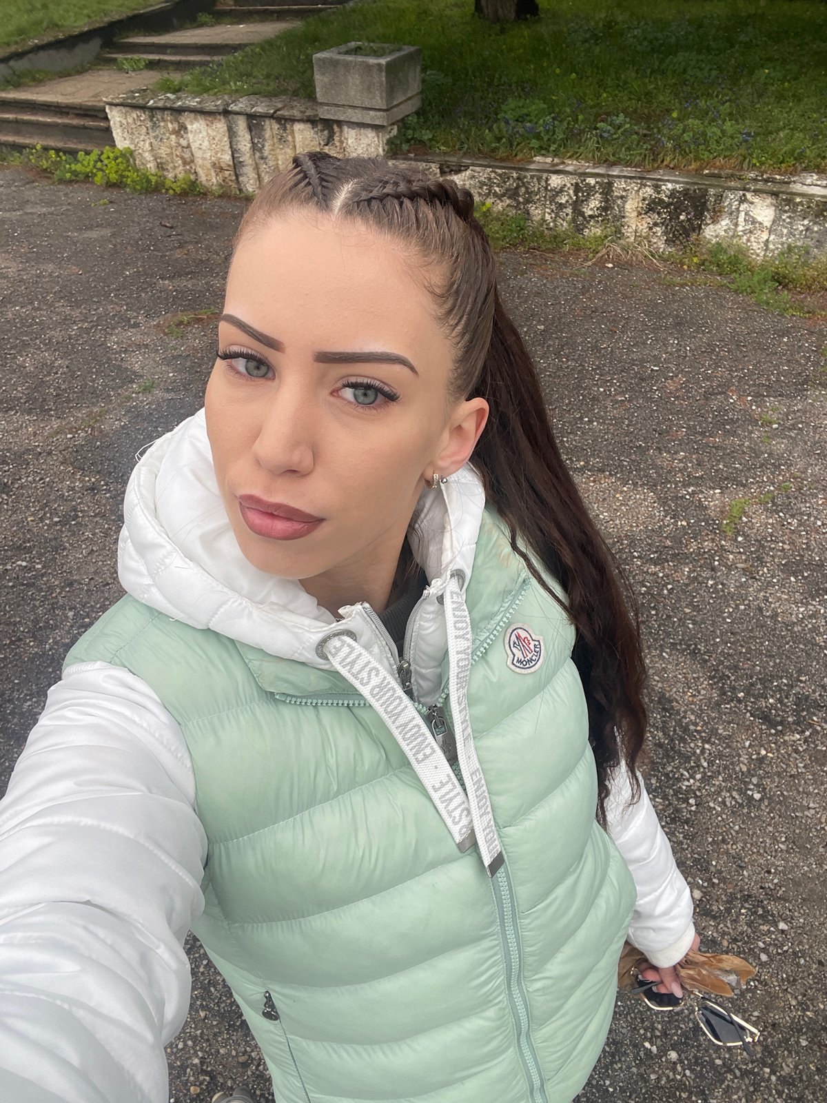 Woman takes selfies by car in Veliko Tarnovo