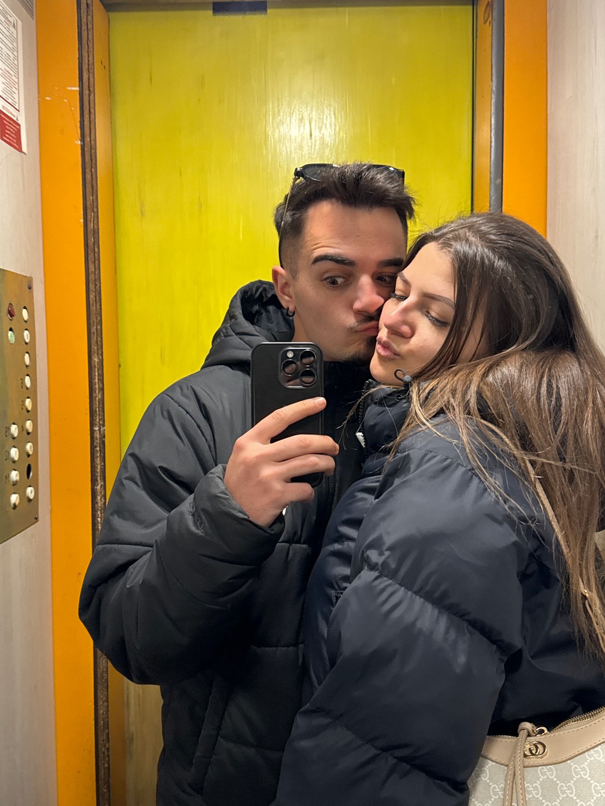 Evening snapshots capture couple's selfie, playful dog in Sofia