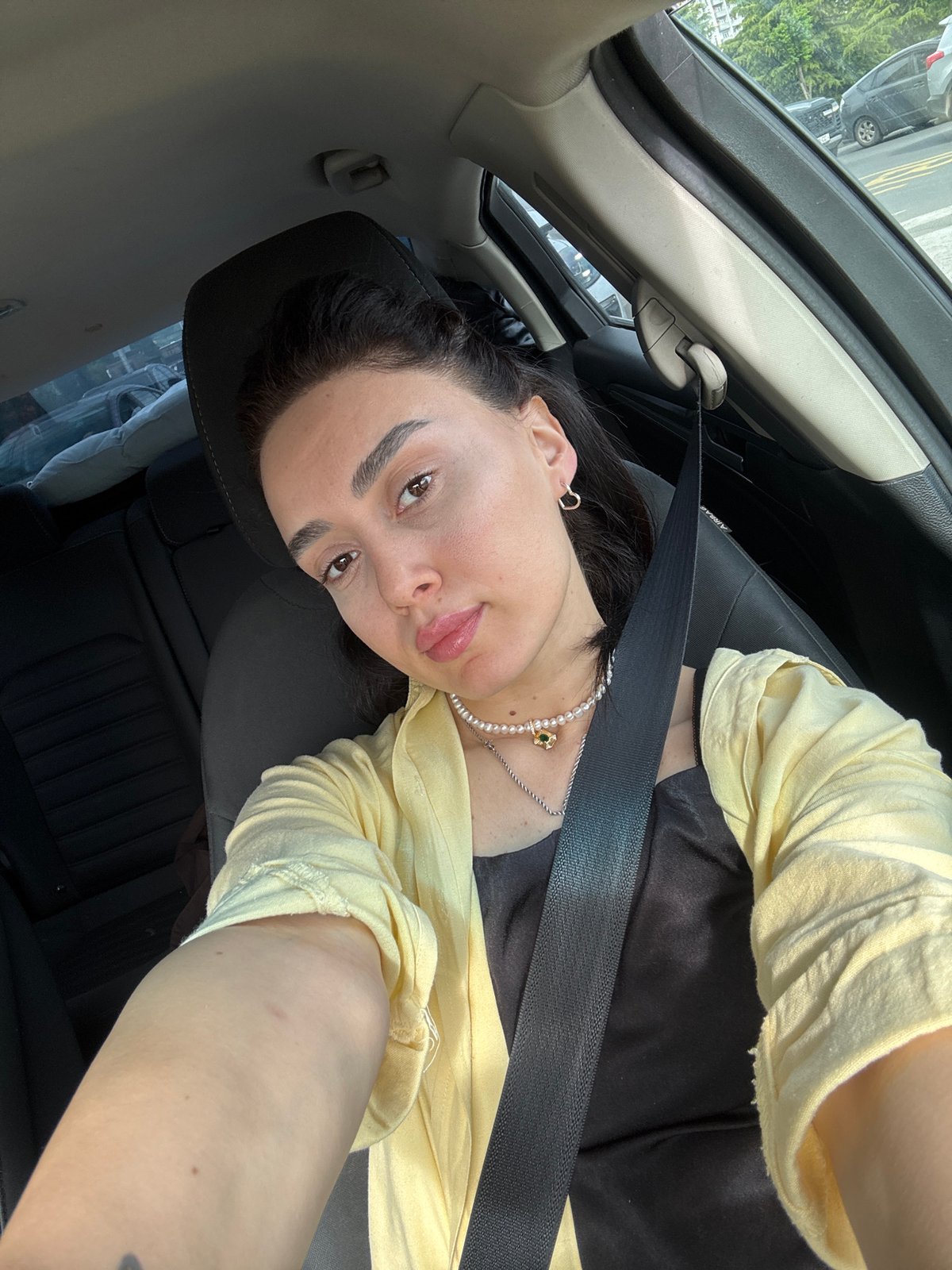 Woman in car during morning traffic in Tbilisi