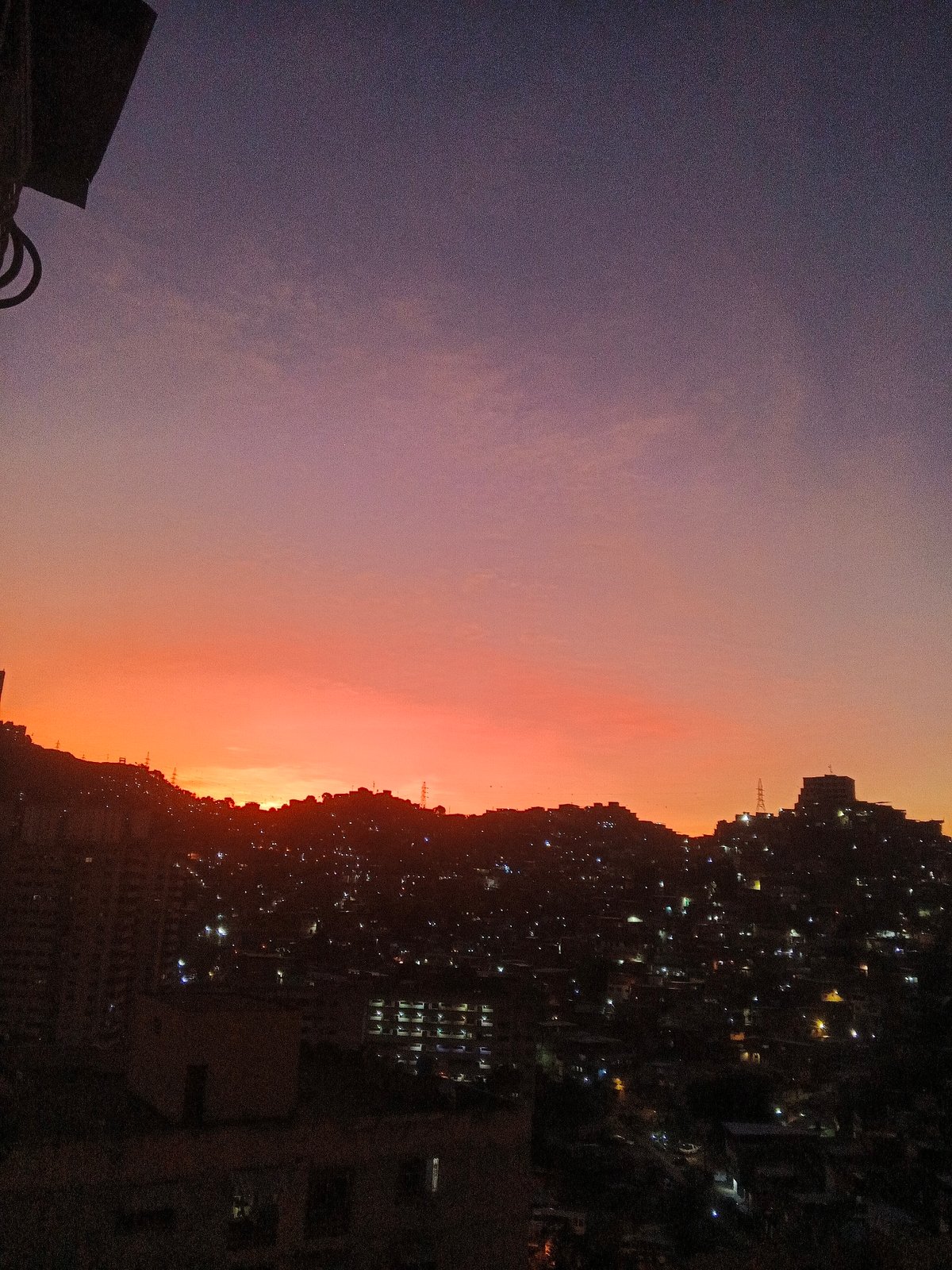 Caracas residents capture sunset transition across Venezuelan capital's skyline