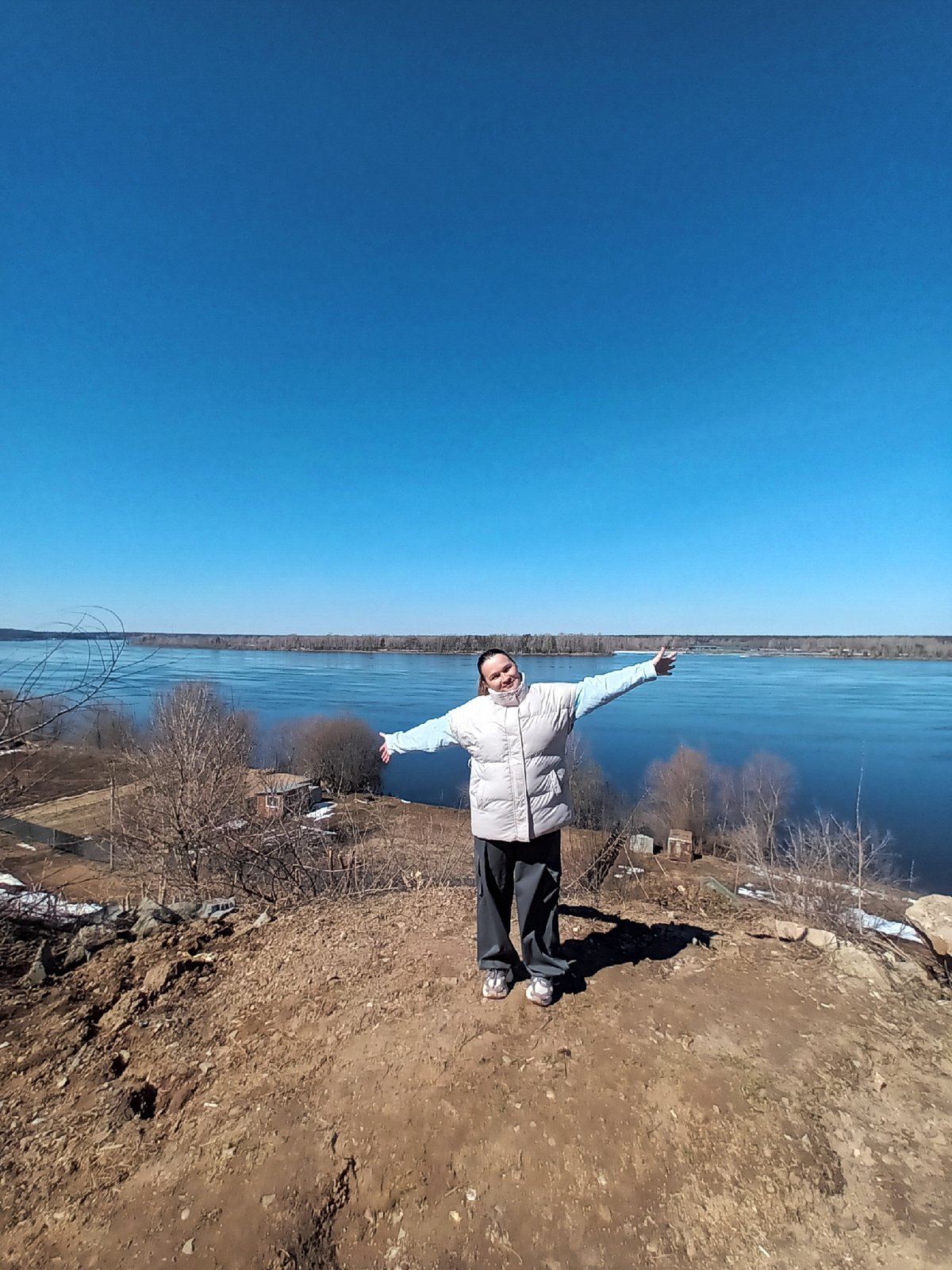 Morning riverside activities captured in Ольховка, Russia