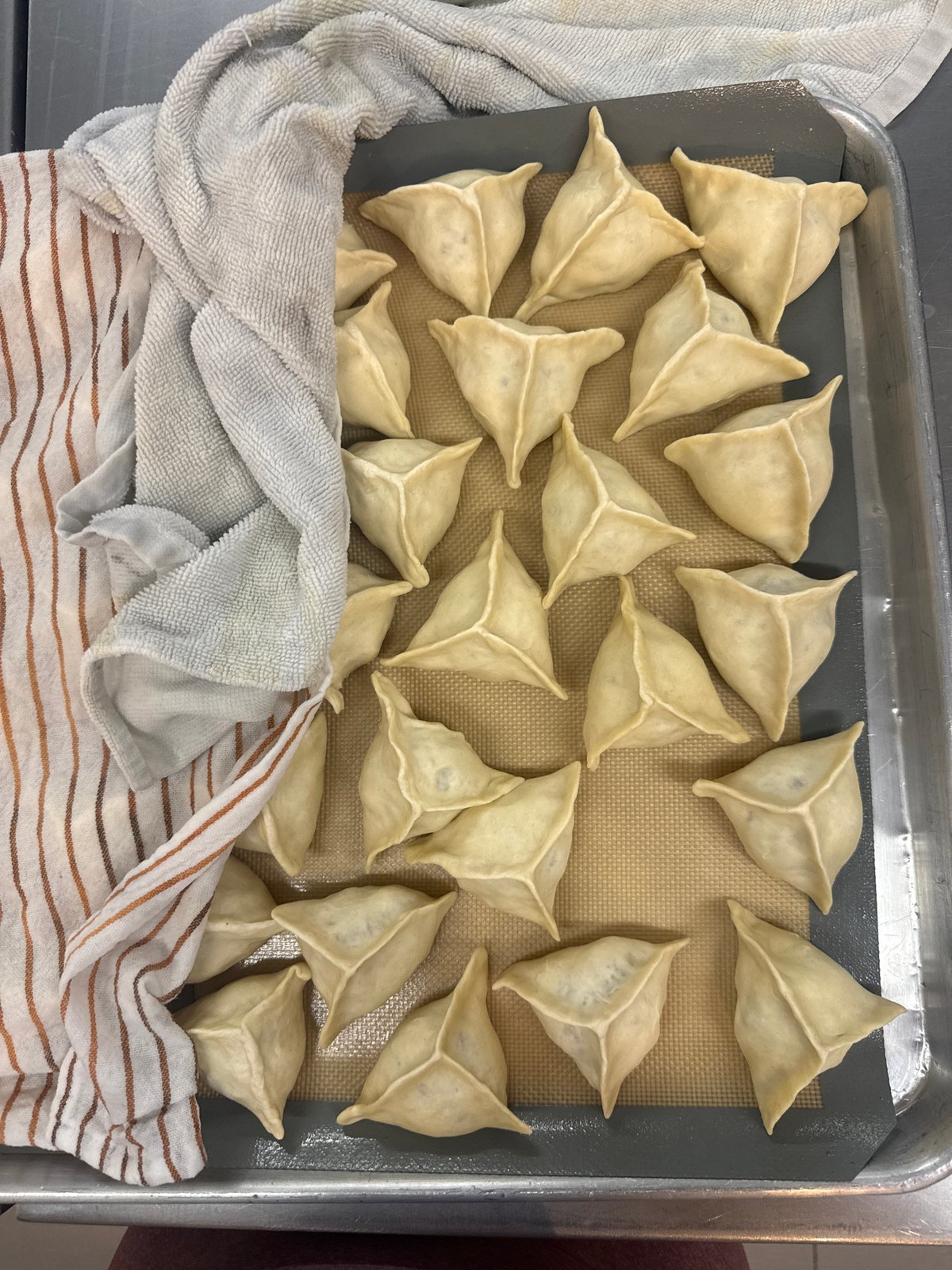 Home baker prepares triangular pastries in Naucalpan de Juárez