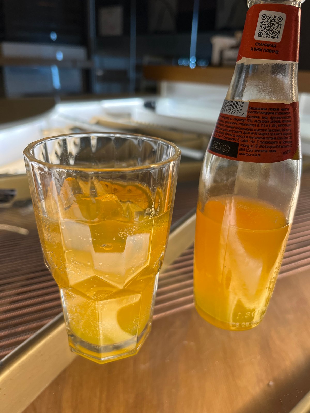 Spilled soda bottle documented on Karlovo sidewalk during evening