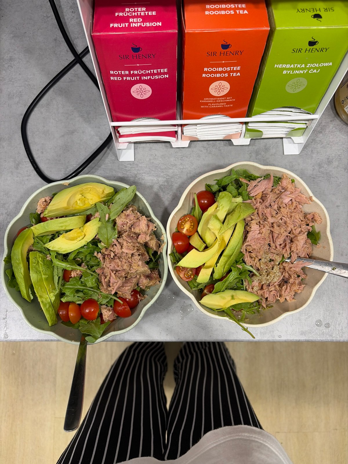 Tuna salad prep with scattered greens on kitchen floor