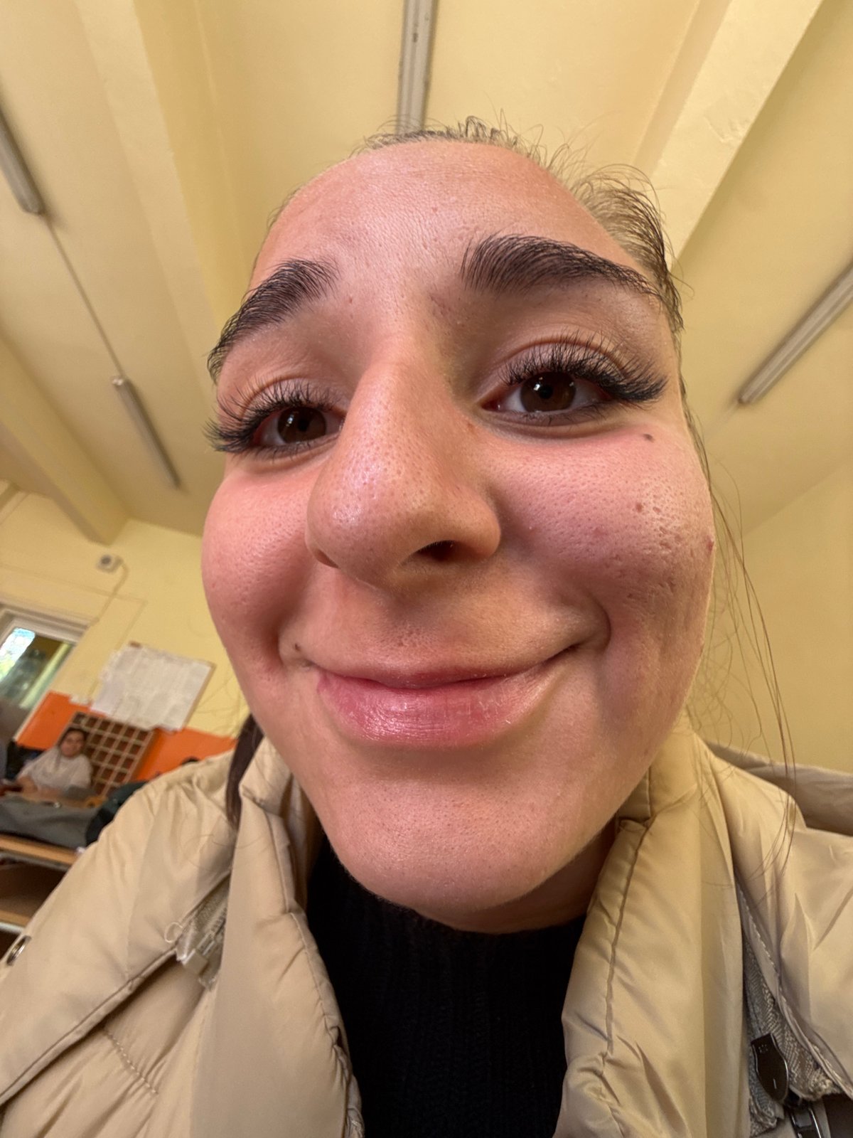 Student photographed smiling in Sofia classroom Monday morning