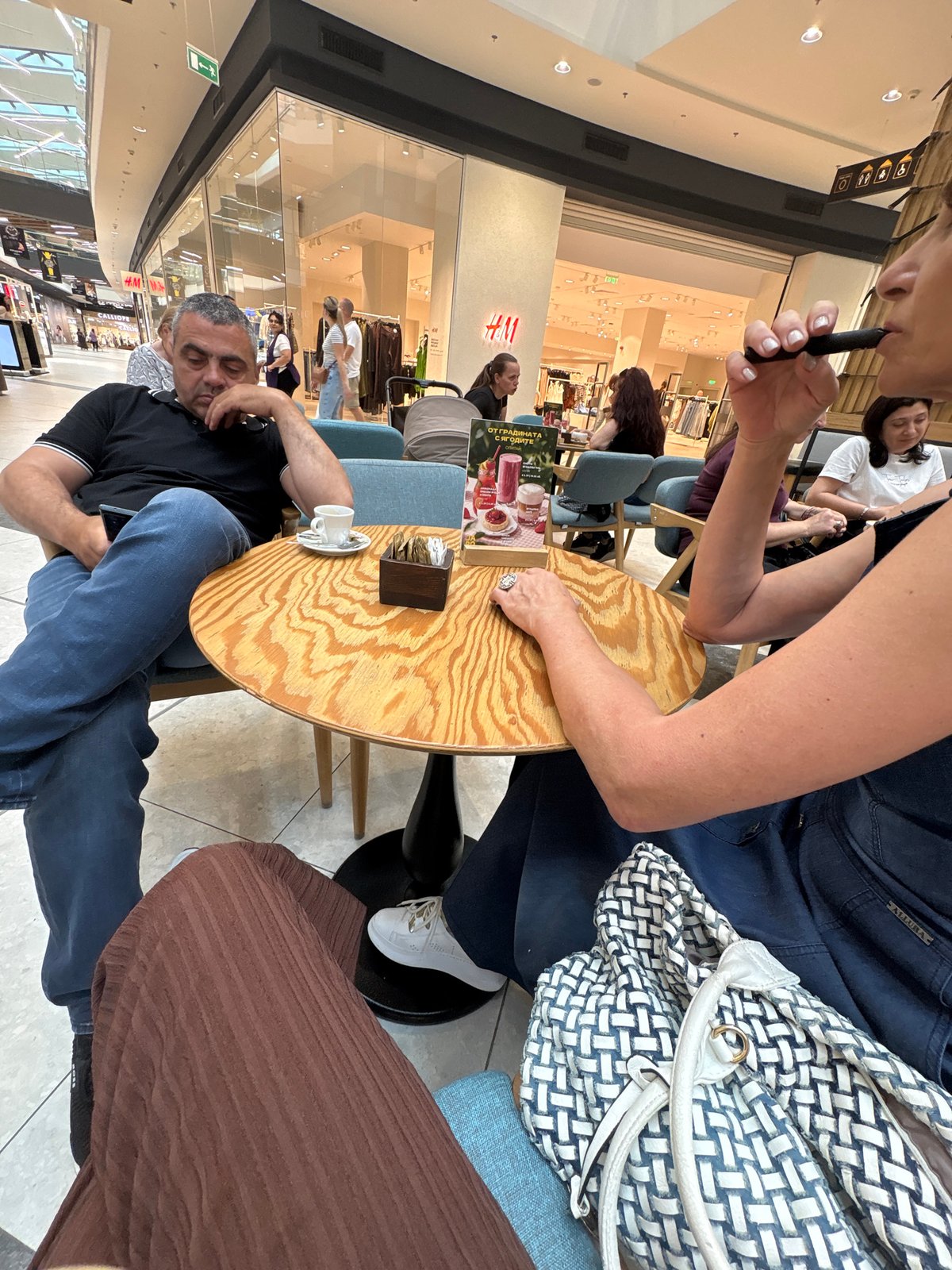 Cafe visit documented through selfies and food photos in Burgas