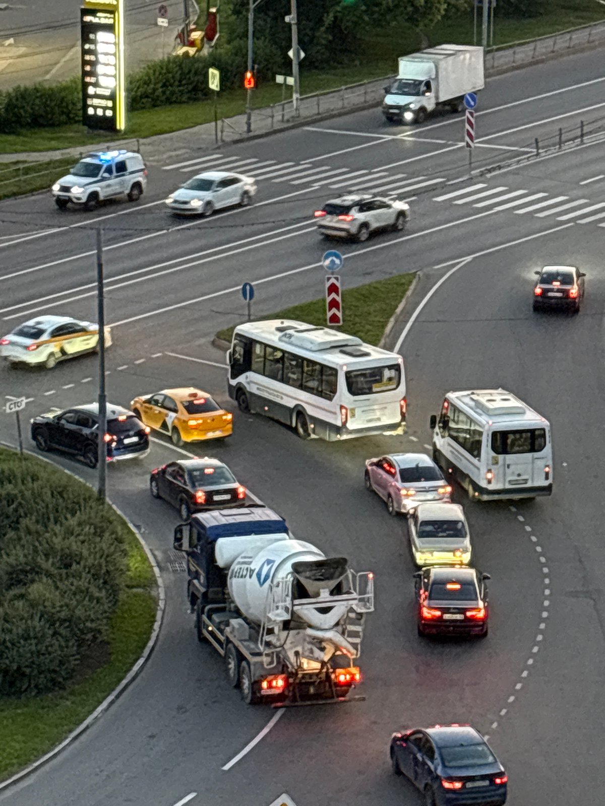 City intersection gridlock at golden hour, construction traffic included