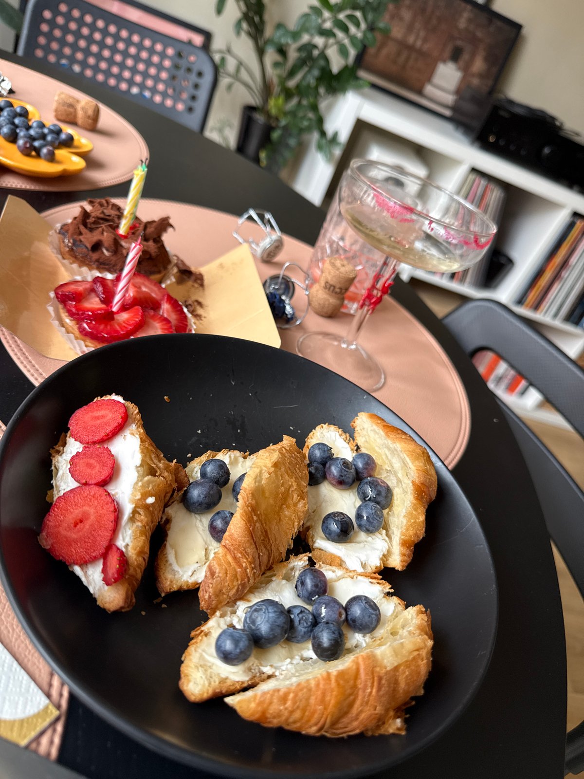Celebratory meal with desserts and candles captured in Barcelona