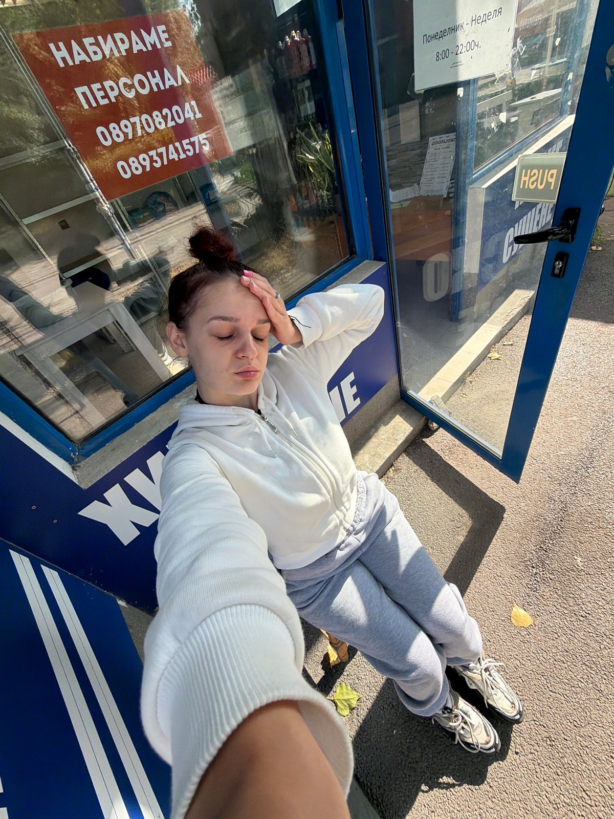 Quick selfie session outside a Sofia kiosk on a July morning