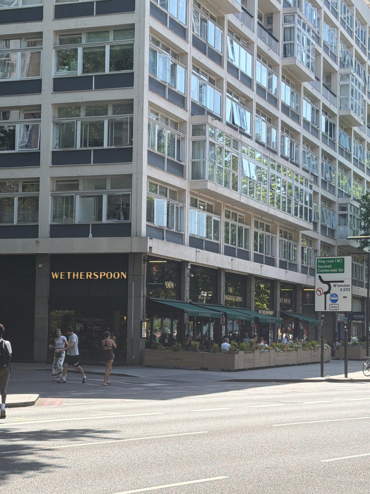 London bus makes routine stop near Wetherspoon pub