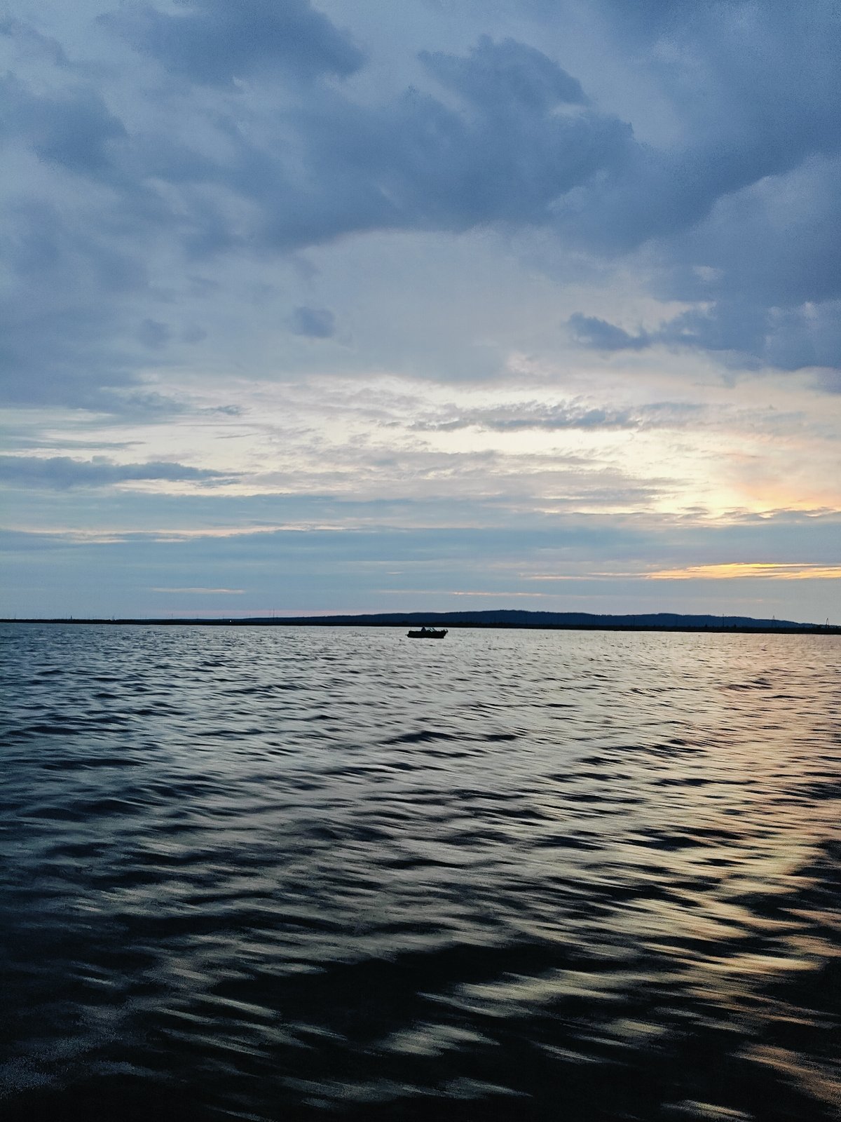 Overcast evening on the waterfront near Chaikovsky, Russia