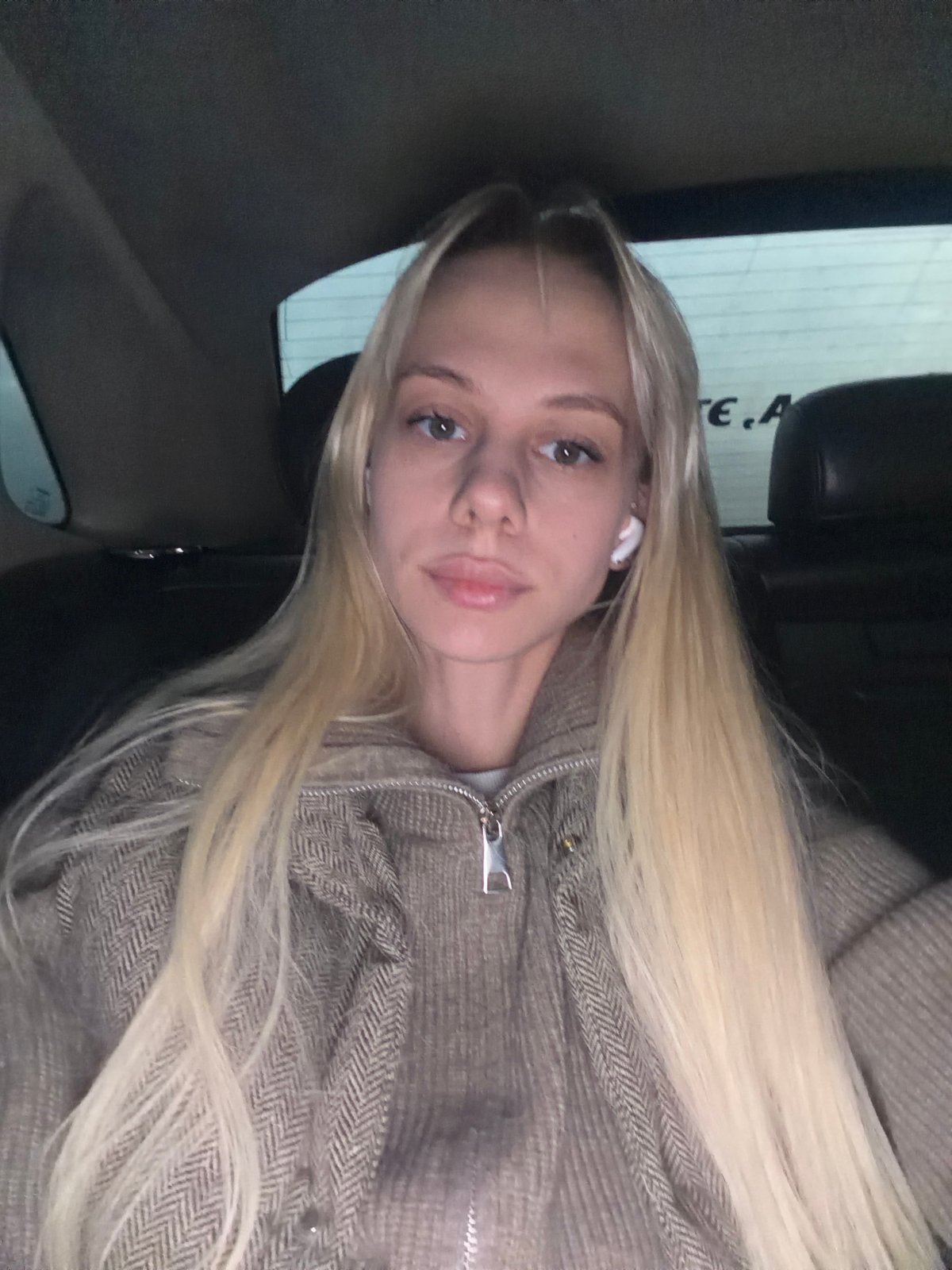 Woman in patterned jacket spotted inside vehicle in Moscow