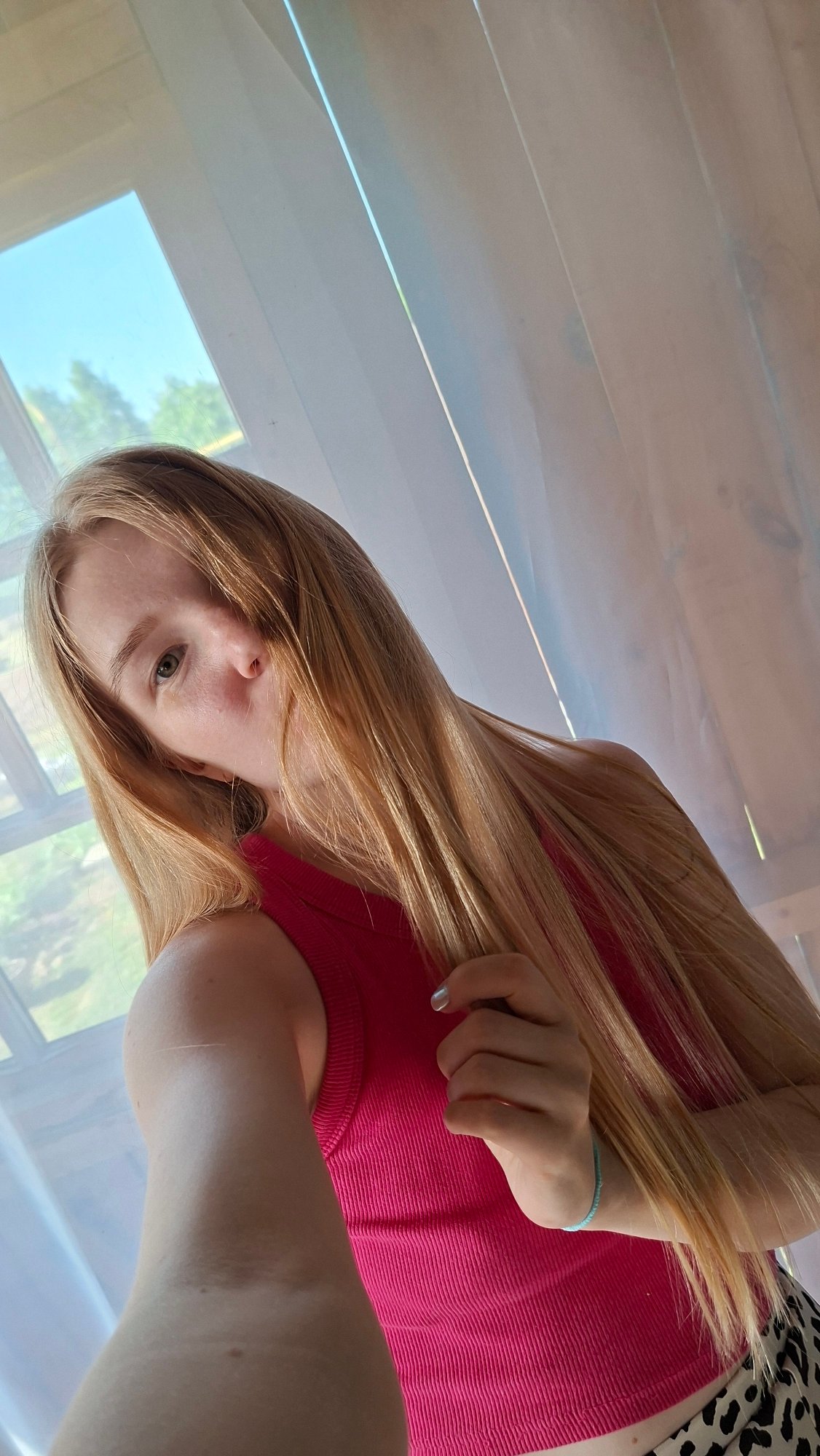 Woman takes selfies during countryside photo session in Russia