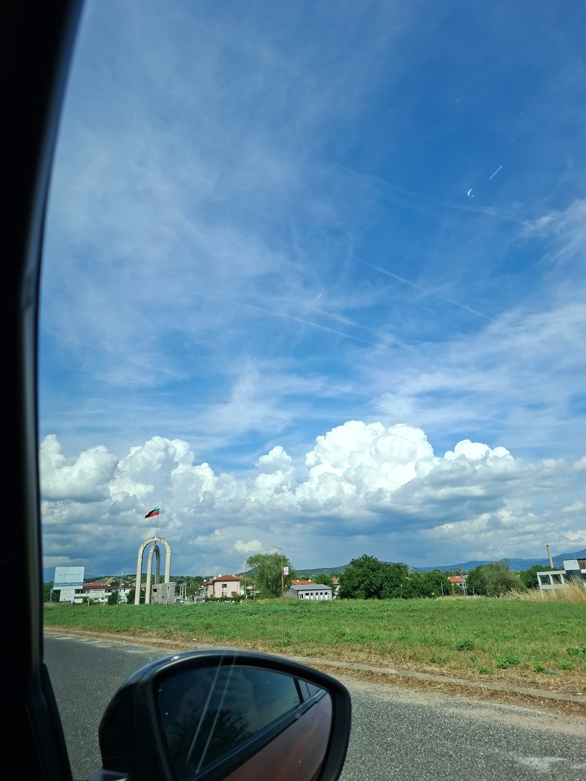 Clear blue sky viewed from car interior in Banya