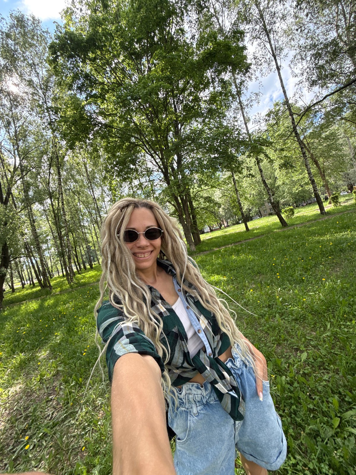 Woman enjoys spring afternoon at Rusanovo park, visits local store