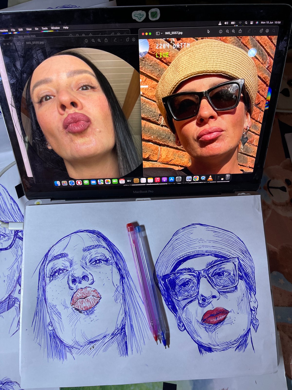 Artist creates pen portraits while referencing laptop photos in Jos