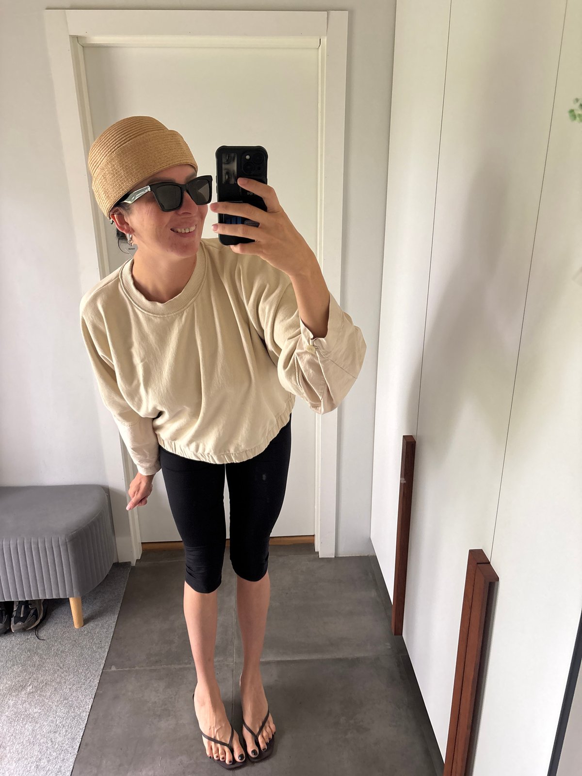 Woman takes mirror selfies with child in Chaikovsky home