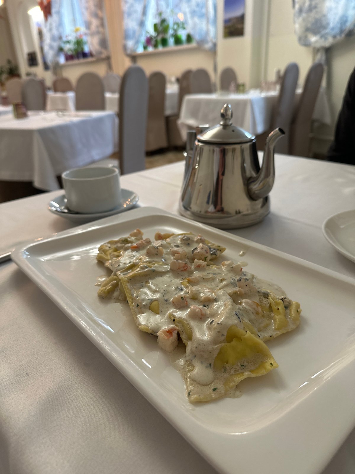 Lunch documented at upscale restaurant with pasta and pizza