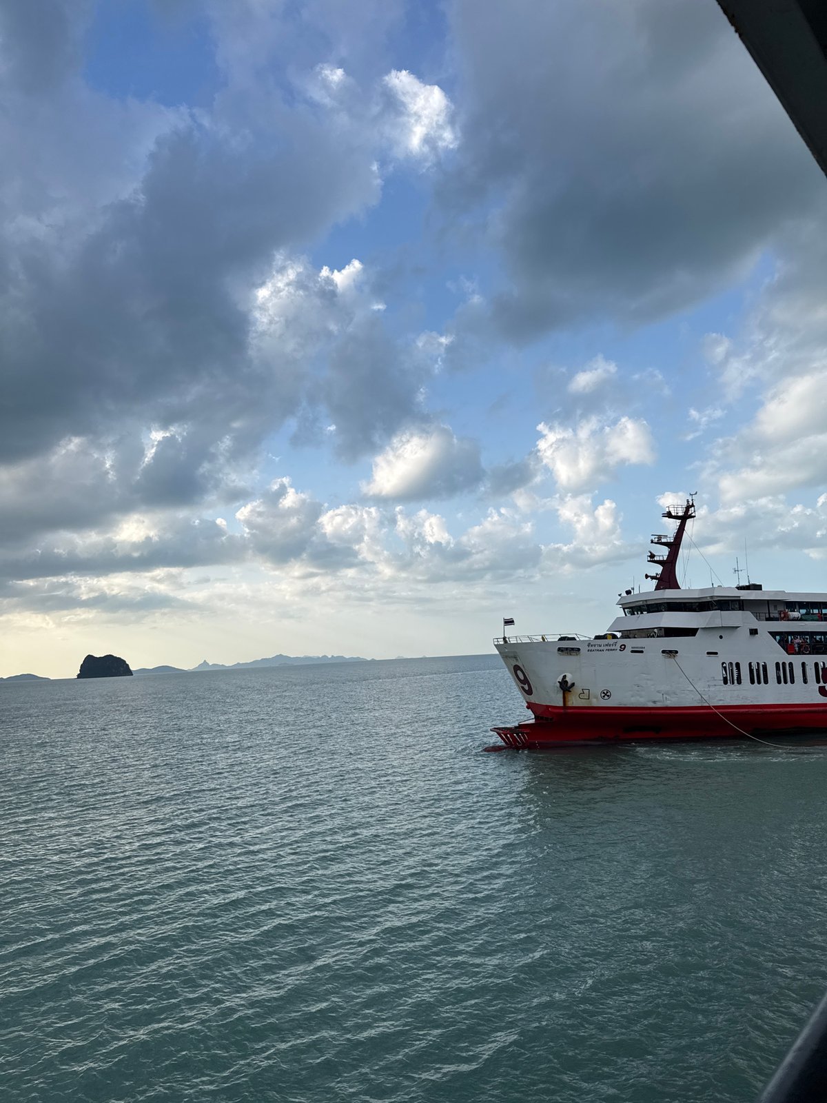 Multi-deck ferry cruising Gulf of Thailand waters near Don Sak