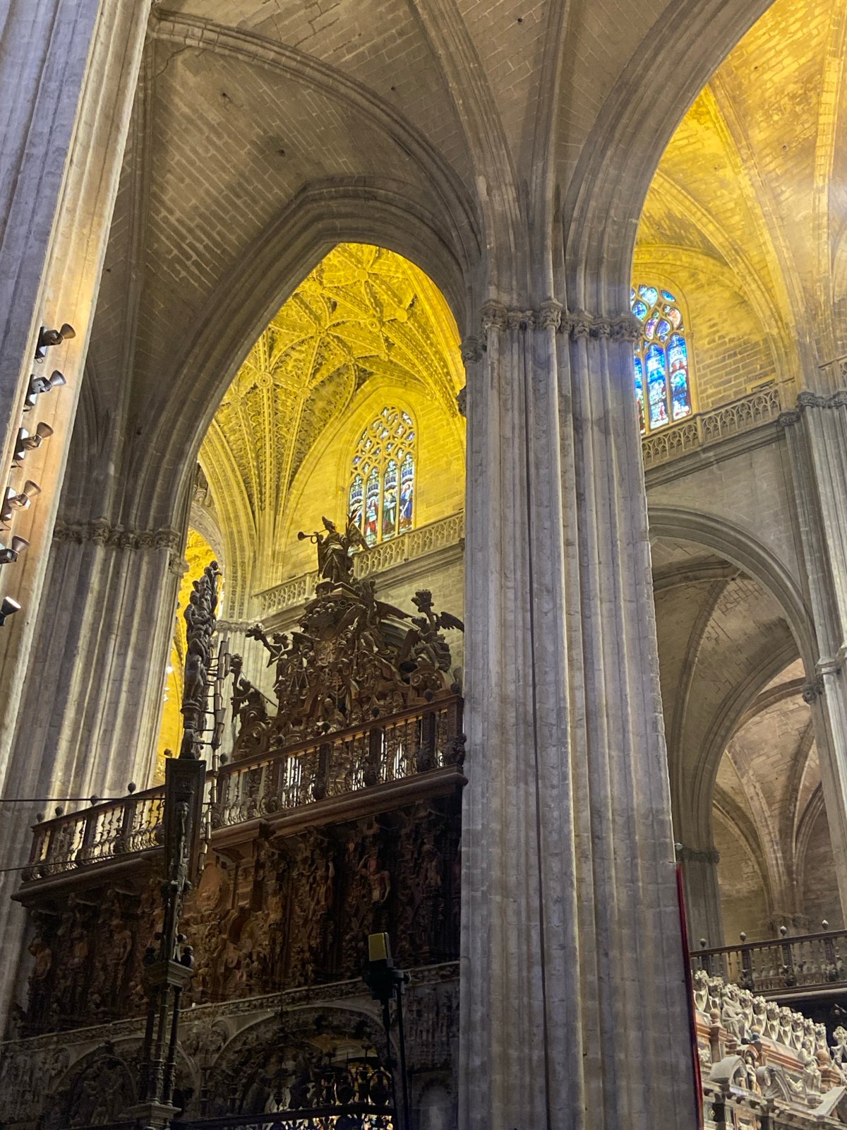 Visitor photographs Seville Cathedral's vaulted interior architecture