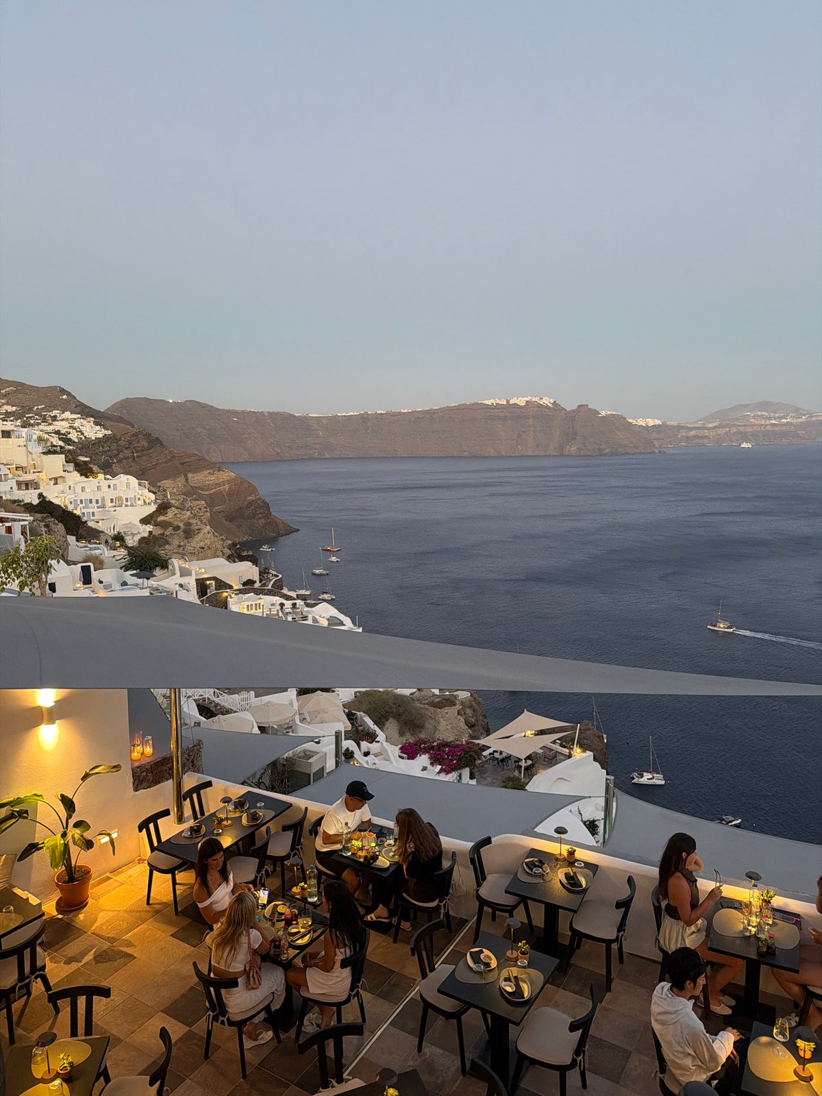 Oia, Santorini glows as dusk fades into night