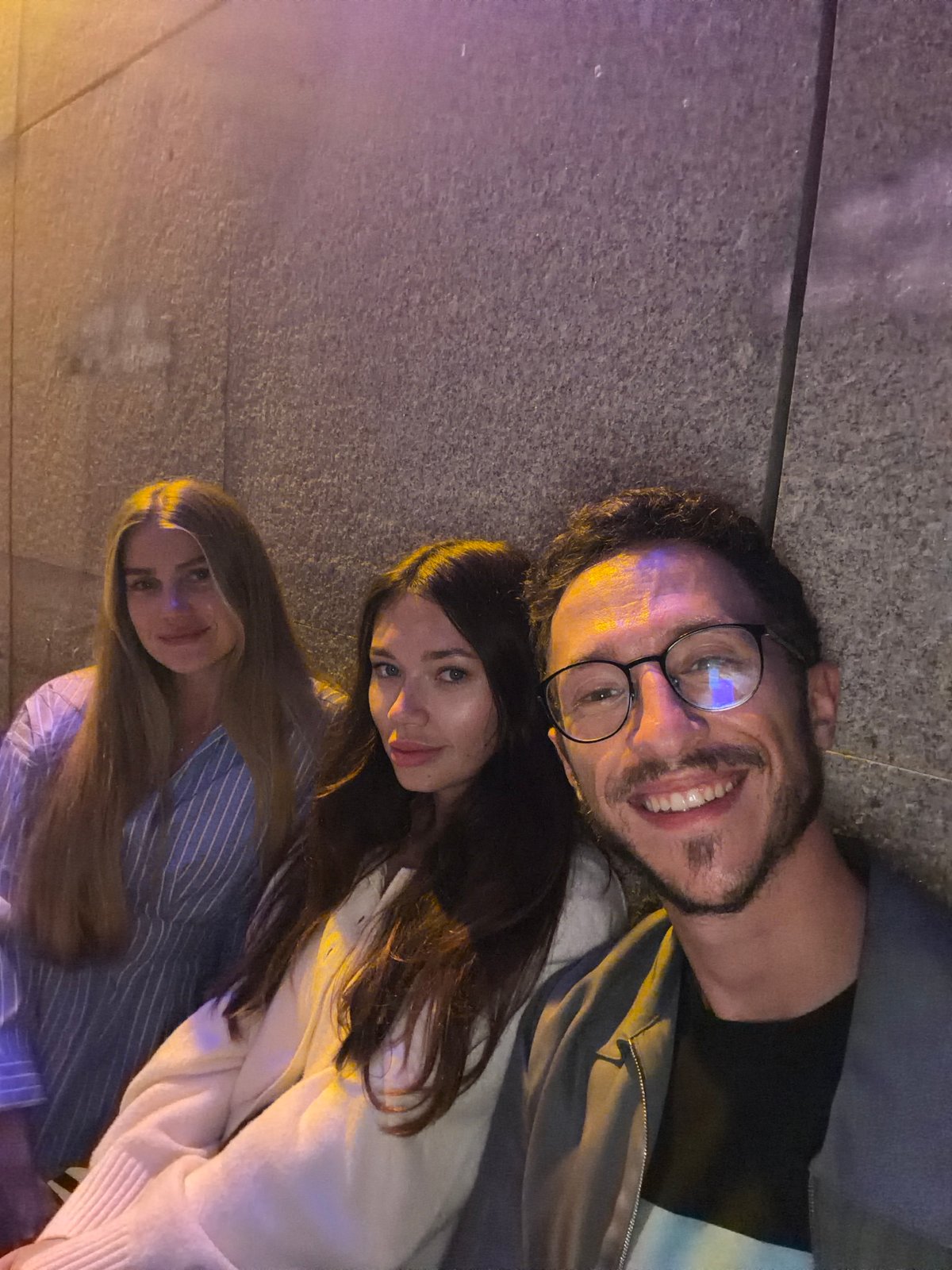 Three people lying on pavement in Tel Aviv