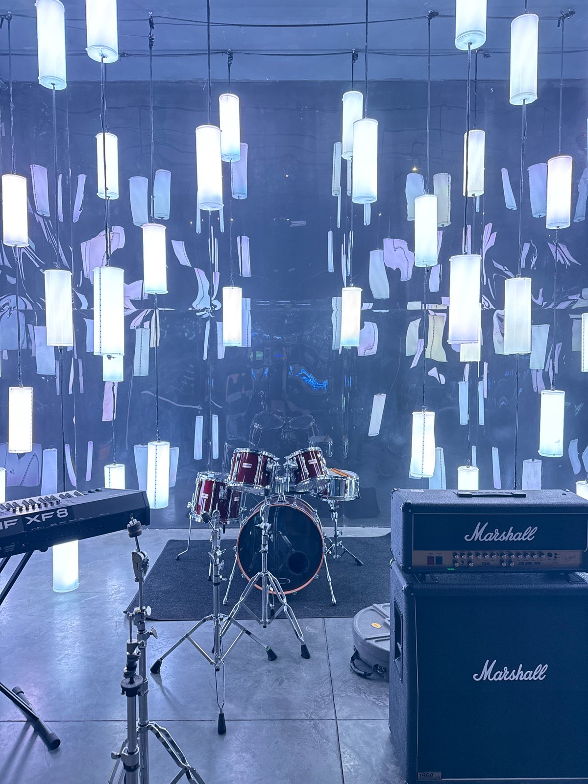 Music equipment setup documented in Moscow rehearsal space