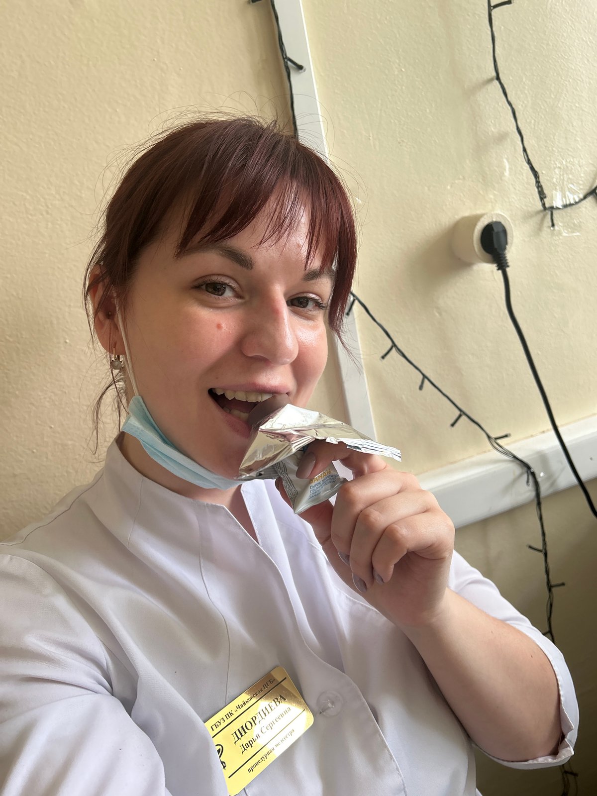 Healthcare worker takes snack break in Фоки, Russia