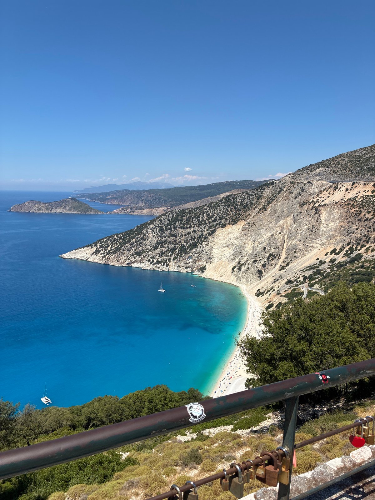 Looking down on Myrtos Beach's crescent shoreline from above