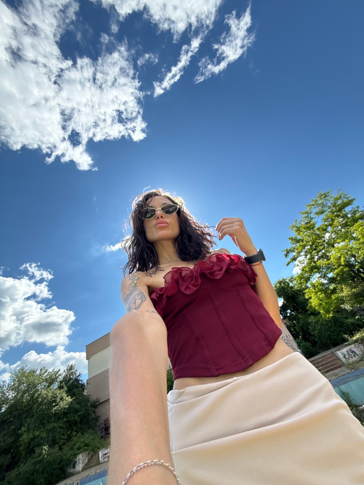 Woman takes selfies at abandoned pool, urban sites in Pleven