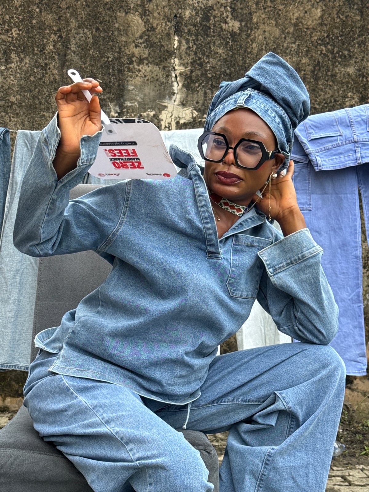 Courtyard scene in Ado with denim outfits and laundry