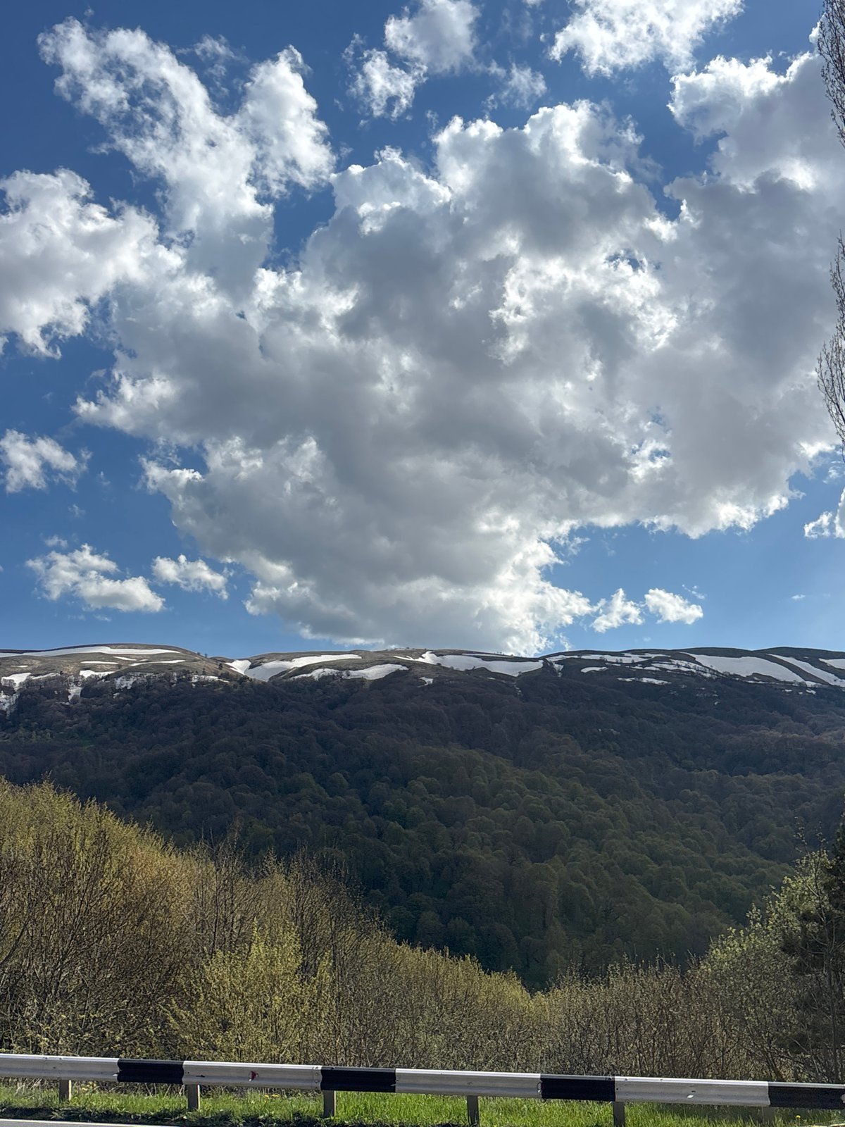 Travelers document ordinary mountain road moments in Dilijan, Armenia