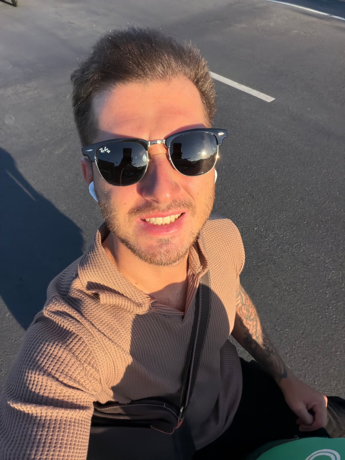 Man takes sunny selfie in North Kuta, Indonesia