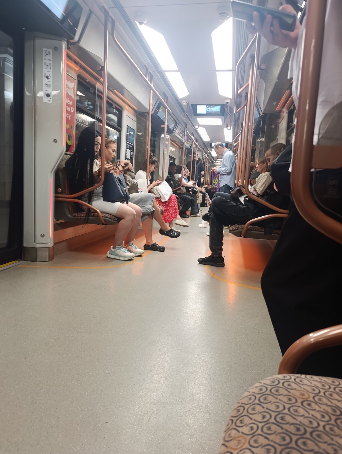 Inside a grand subway station and its arriving train