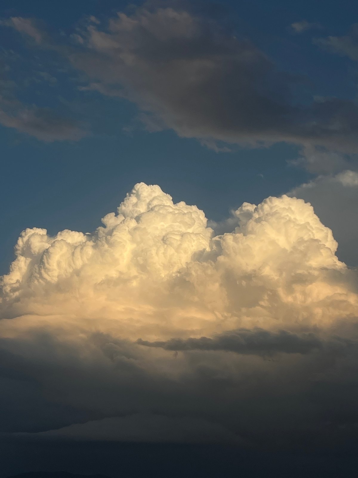 Dramatic cumulus clouds at golden hour over Gabrovo, Bulgaria.