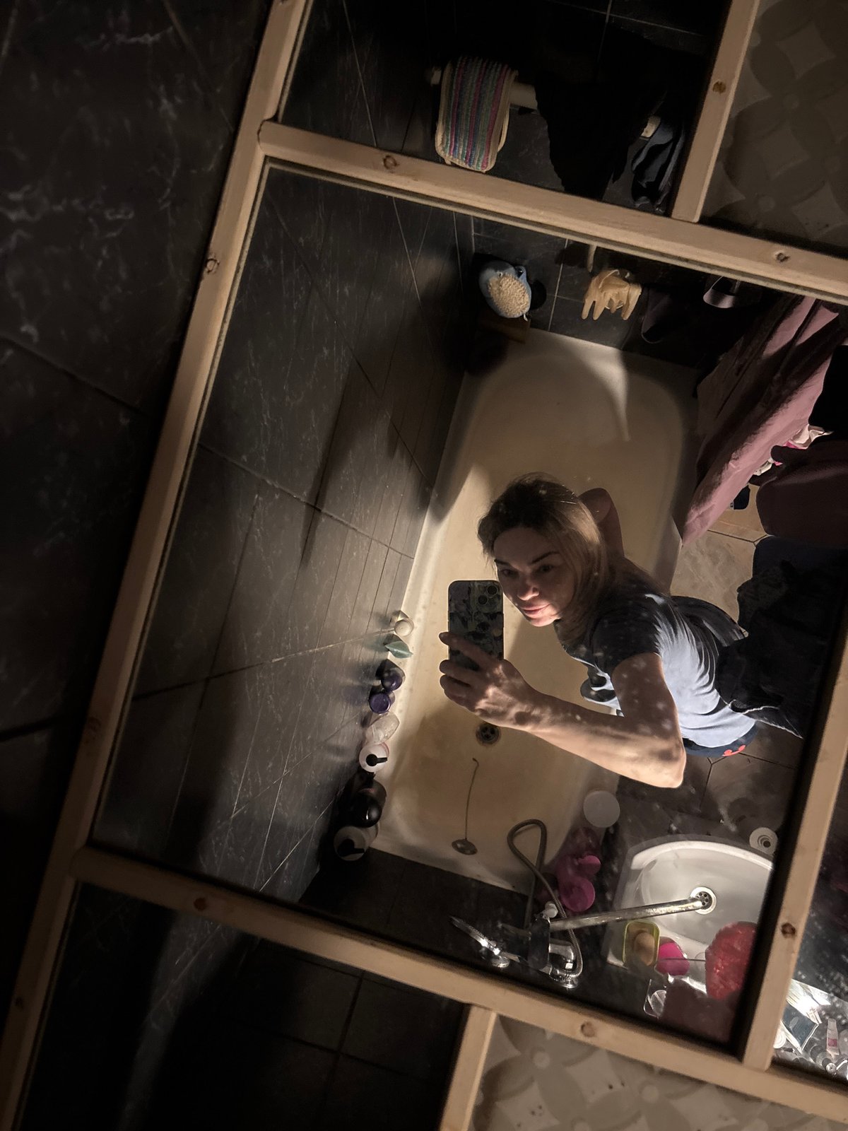 Woman documents evening routine with selfies in Vsevolozhsk apartment