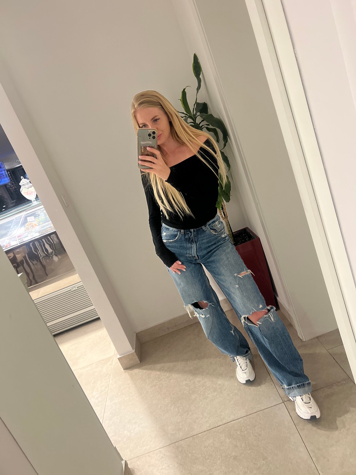 Woman takes mirror selfie in Boreti, Montenegro