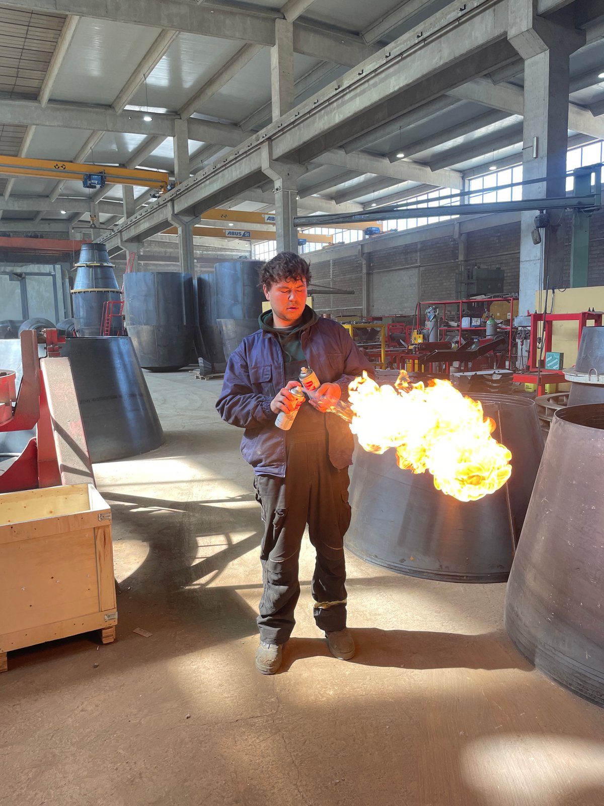 Worker conducts flame welding operations at Montenegro industrial facility