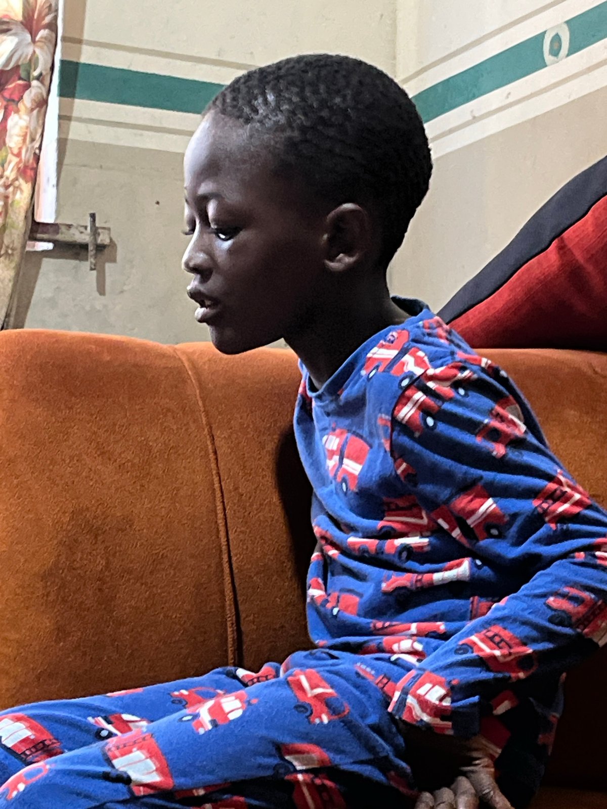 Children in car pajamas share meal, play in Badagry home