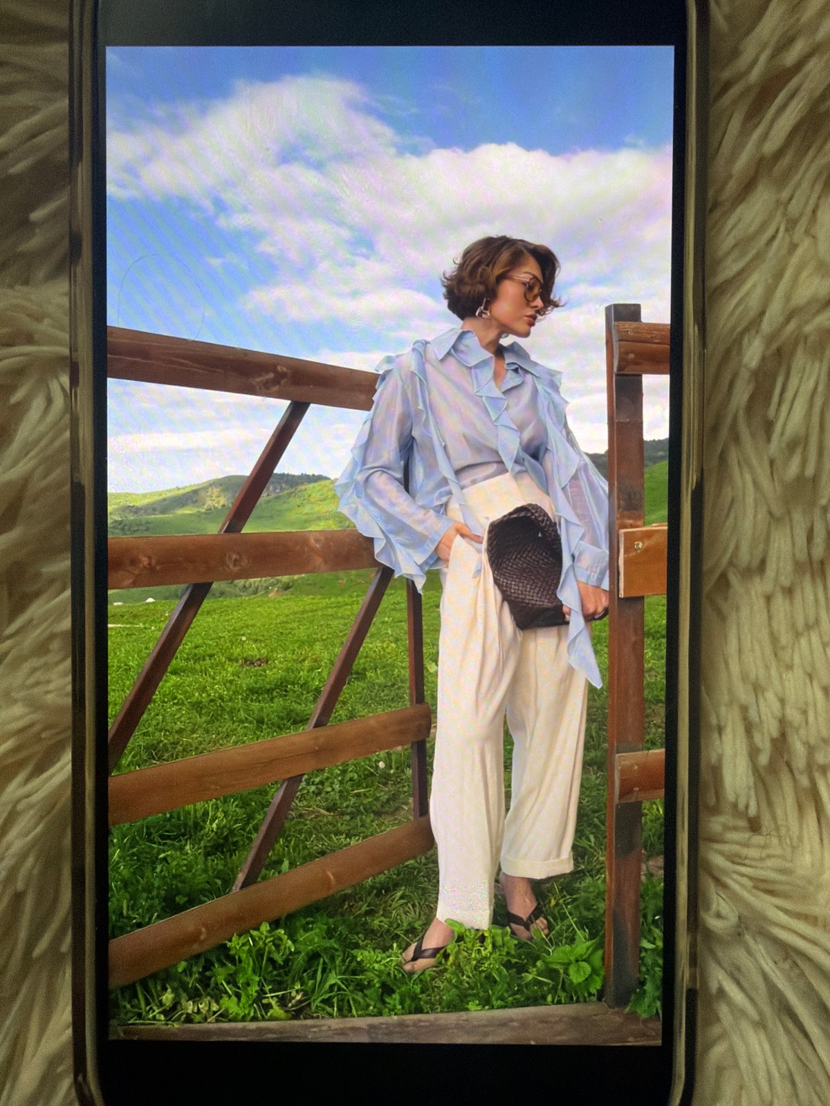 Summer photoshoot memories viewed on smartphones in Bishkek