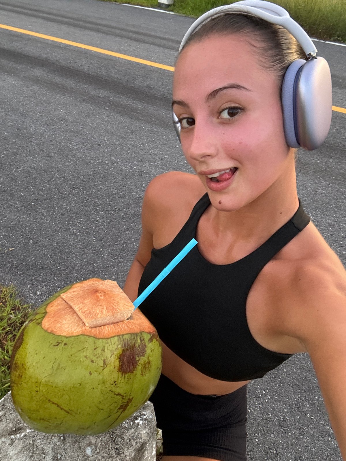 Woman Takes Athletic Selfies on Chalong Road