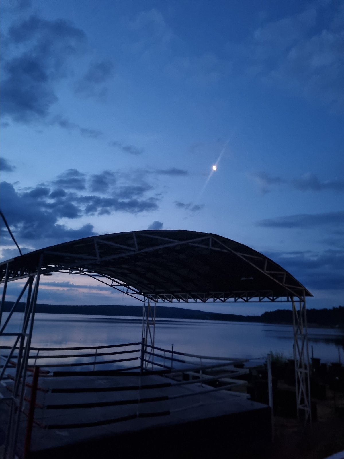 Outdoor boxing ring by the Kama River at twilight