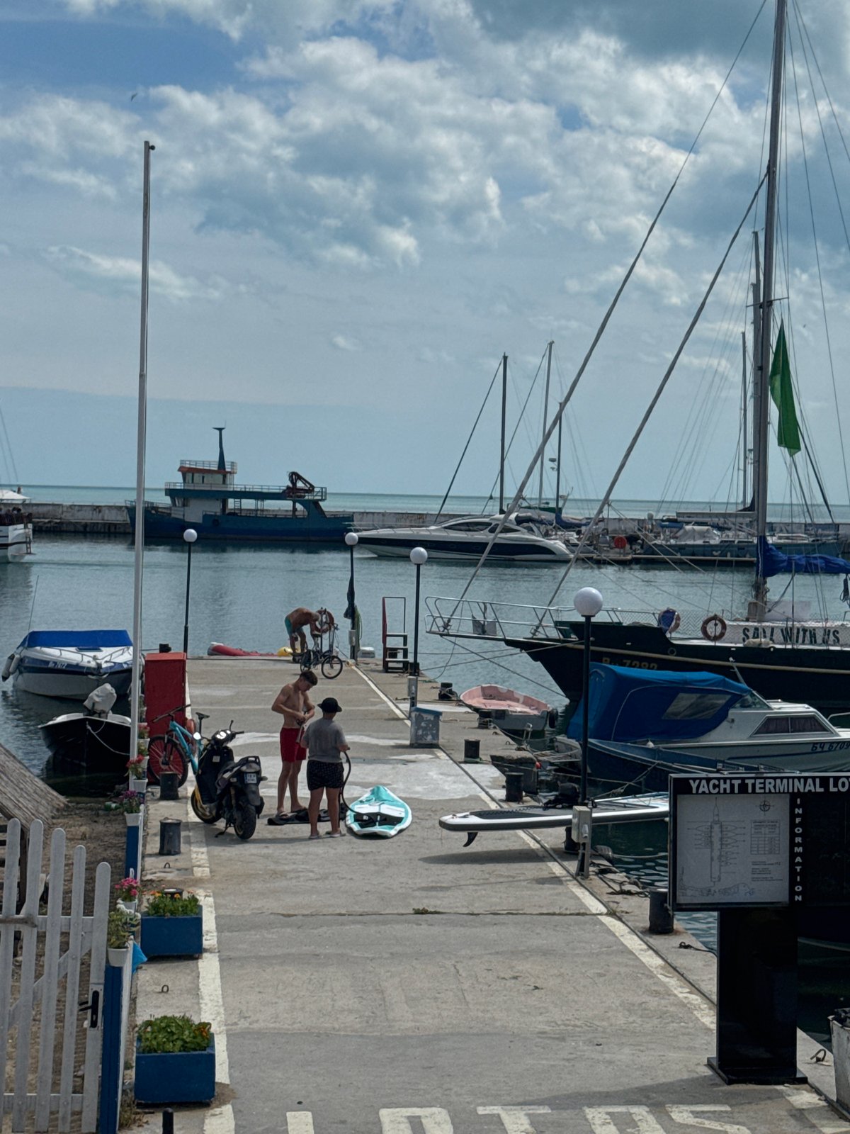 Balchik waterfront in full summer swing, marina to café terraces