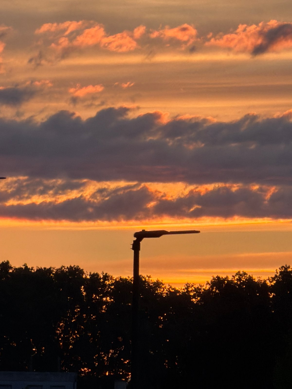 Dramatic sunset lights up Strasbourg sky with colorful clouds