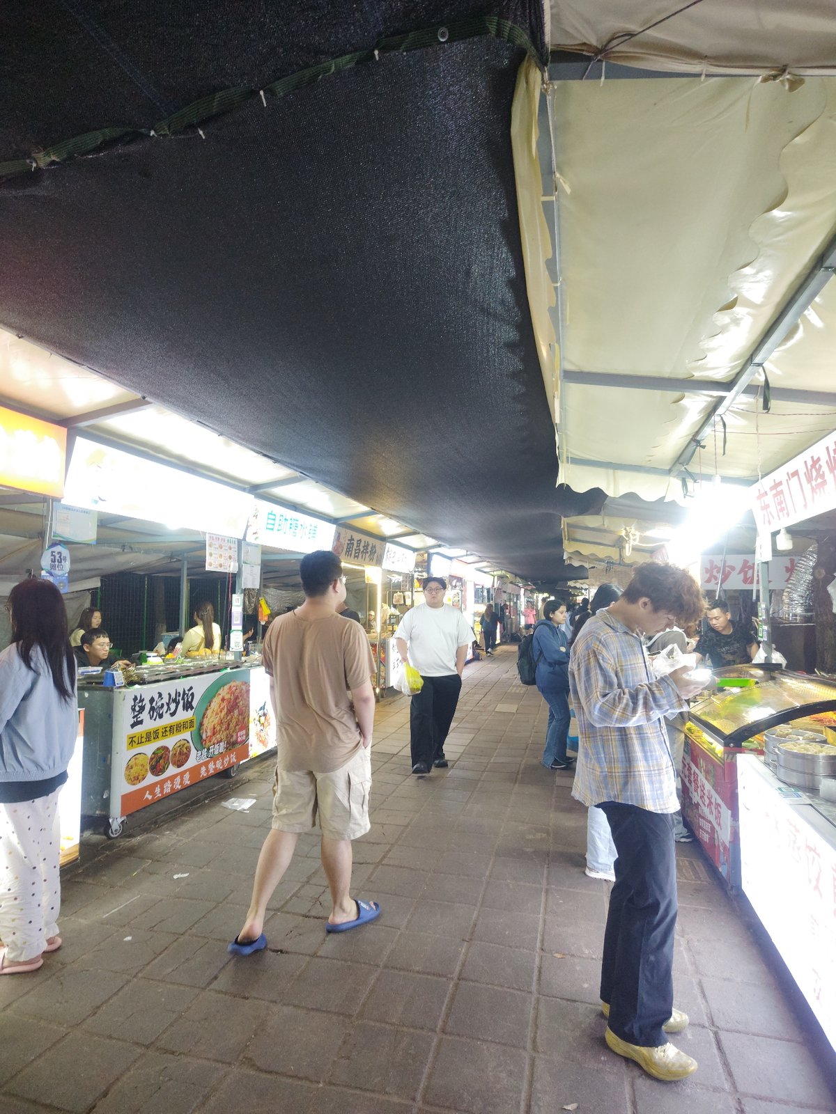 Evening food market bustles in Shapingba District, China